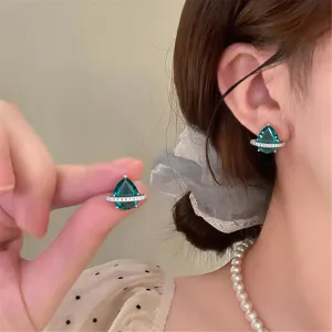 Elegant pear-shaped zircon orb earrings detailed with sparkling crystals. Perfect chic jewelry accessory.