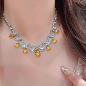Elegant silver wavy teardrop necklace with sparkling zircon crystals for women fashion.
