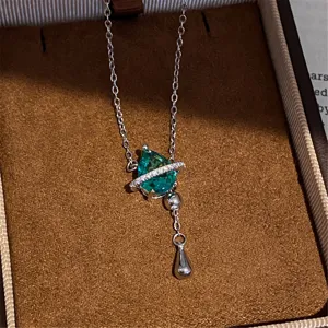 Detailed view of the sparkling blue zircon waterdrop necklace with delicate silver chain in box.