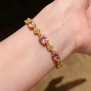 Elegant 18k gold plated oval pink zircon flower bracelet for women, chic fashion wrist jewelry.