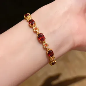 Exquisite 18K gold plated oval red stone and zircon flower bracelet for women, elegant jewelry.