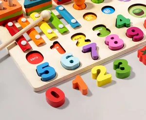 Wooden Montessori early education toy detail showing number blocks, xylophone and matching slots.
