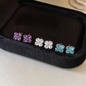 Four-leaf clover zirconia stud earrings in purple white blue, elegant minimalist jewelry.