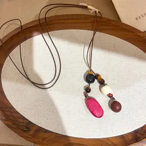Boho botanical acorn necklace detail view, rustic handmade jewelry for women statement.