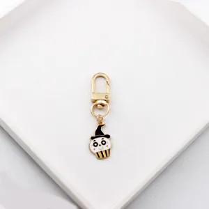 Cute Halloween devil hat skull alloy keychain bag charm and stylish Airpods pendant accessory.