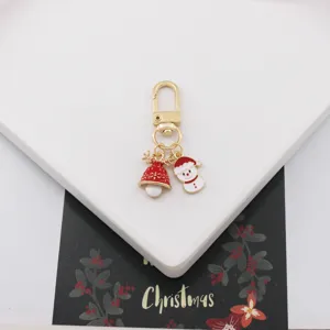 Weihnachten Legierung Schlüsselanhänger mit süßen Schneemann und Glocke Anhänger, Taschenschmuck.
