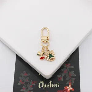 Weihnachten Serie süßer Legierung Schlüsselanhänger Taschenanhänger, Detailansicht mit Rentier und Glocke.