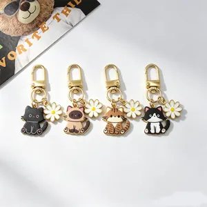 Cute alloy cat pendant keychain, adorable cartoon kitty metal charm for bags and keys.