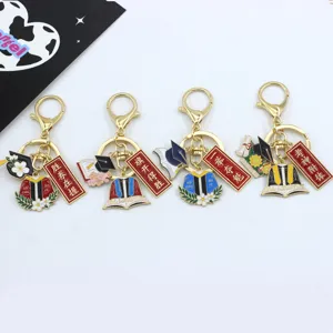 Graduation metal keychain set with doctoral hat and blessing banner pendants for students.