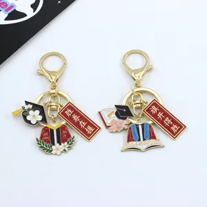 Graduation metal keychain set with doctor hat and blessing card charms for students.