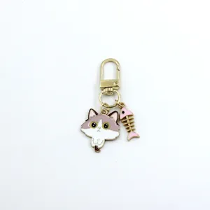 Detailed view of the cute cat and fish bone alloy metal keychain charm, perfect for bags.