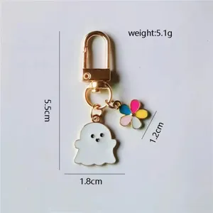 Llavero metálico de fantasma y flores, accesorio perfecto para bolsos y llaves de coche.