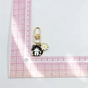 Cute alloy cat keychain and flower pendant, metal charm for bags, keys, and airpods decor.