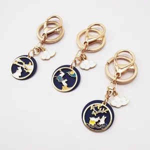 Japanese style alloy oil-drop keychain featuring cute rabbit, moon and cloud pendants for keys.