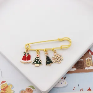 Christmas alloy brooch pin with cute charms like bells trees and snowflakes for coat bags.