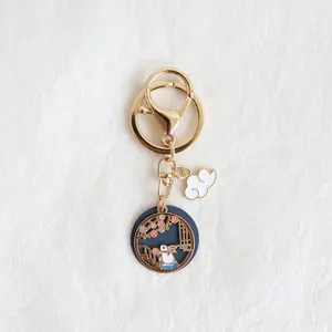 Detailed view of Japanese style alloy oil-drop rabbit cloud keychain charm accessory.