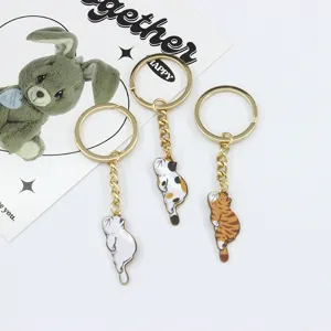 Cute lying cat keychains set, alloy animal key rings, creative bag pendants and accessories.