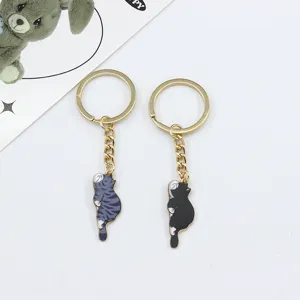 Cute lying cat keychain set, enamel alloy metal cat bag charms and car key rings for women.