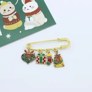 Christmas alloy safety pin brooch with cute cartoon charms like reindeer and gift box.