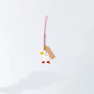 Lindo colgante de teléfono de pato de dibujos animados con llavero y bonito cordón rosa.