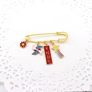 Gold tone safety pin brooch with cute charms study success auspicious exam detail