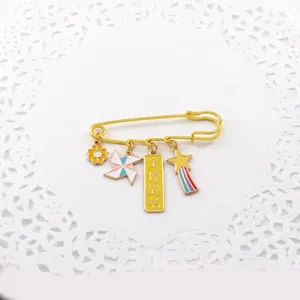 Exquisite golden enamel safety pin brooch with inspiring blessing charms, perfect for students.