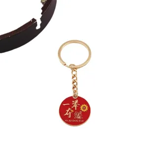 Porte-clés de réussite d'examen inspirant avec pendentif rond rouge et anneau métallique.