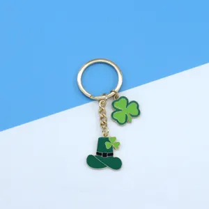 St. Patrick's Day metal keychain with green shamrock and leprechaun hat bag charm.