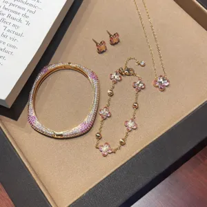 Luxury gradient zircon flower jewelry set including necklace, bracelet, earrings and cuff.