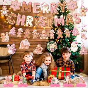 Christmas gingerbread man party decoration set, hanging banners and honeycomb centerpieces.