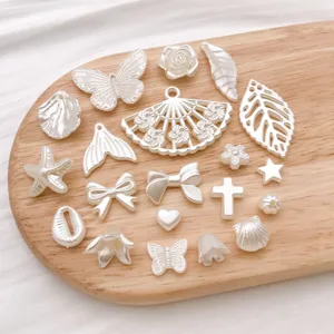 Imitation pearl ABS white DIY jewelry charms mix, cross, bow, butterfly for handmade bracelets.