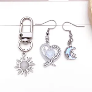 Alloy jewelry accessories detail view, creative sun keychain and cute earrings set.