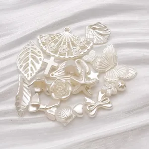 Off-white ABS pearl charms set, detailed view of DIY jewelry findings like bows and starfish.