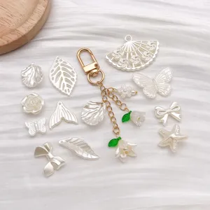 DIY pearl white charm set, imitation pearl alloy keychain and assorted pendants for jewelry making.