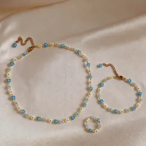 Handmade beaded flower necklace bracelet ring set, summer fresh jewelry accessories detail.