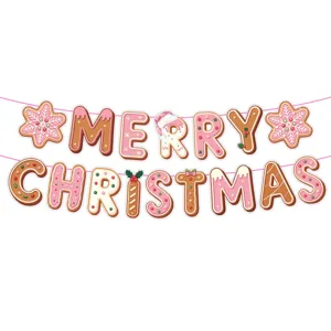 Detailed view of the pink gingerbread Merry Christmas letter banner for festive party decor.