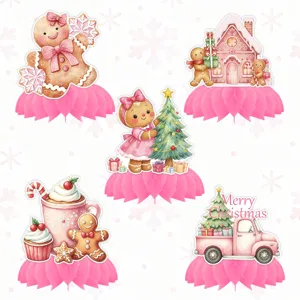 Detailed view of pink Christmas gingerbread honeycomb table centerpieces with cute festive illustrations.