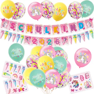Back to school party detail shot featuring cute unicorn balloons and colorful banner flags.
