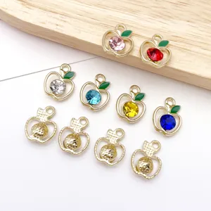 Closeup of colorful rhinestone alloy apple charms for DIY jewelry making and crafts details.