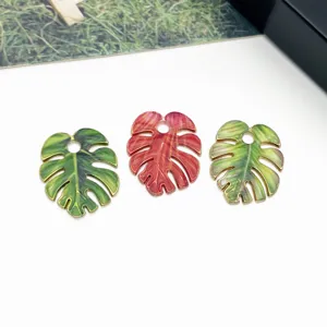 Monstera leaf alloy charm pendant detail view, colorful drip oil jewelry DIY accessories.