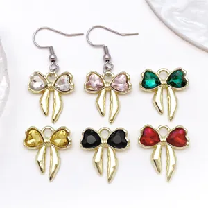 Gold-tone alloy bow charms and earrings with colorful crystal rhinestones for DIY.