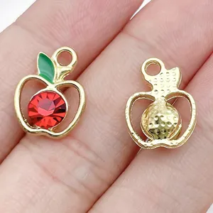 Close-up detail of apple shape alloy rhinestone pendant for DIY jewelry making accessories.