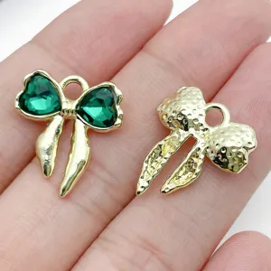 Gold bow alloy charms with green crystal, perfect for DIY handmade jewelry bracelets earrings.