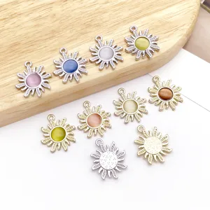 Detailed view of zinc alloy sun charms with cat's eye stone inlay, perfect for DIY crafts.