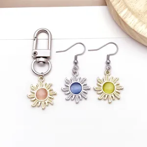Zinc alloy cat-eye stone sun pendant keychain and earrings set for DIY jewelry making details.