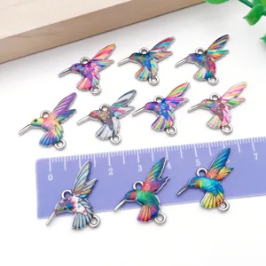 Details of colorful enamel hummingbird double loop charms for DIY jewelry making and bracelets.