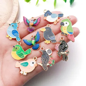 Alloy enamel bird charms close-up, colorful DIY pendant accessories for handmade jewelry.
