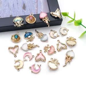 Gold plated marine animal charms mix, resin rhinestone dolphin jellyfish pendants for DIY jewelry.