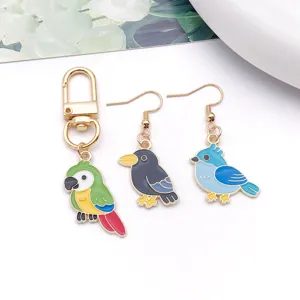 DIY alloy jewelry accessories KC gold bird keychain and earrings set with cute drip oil pendants.