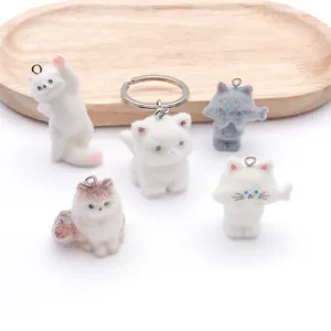 Cute resin flocked cat keychain pendant, 3D animal bag charm and car key ring accessory.